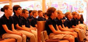 An image of children sitting in pews.